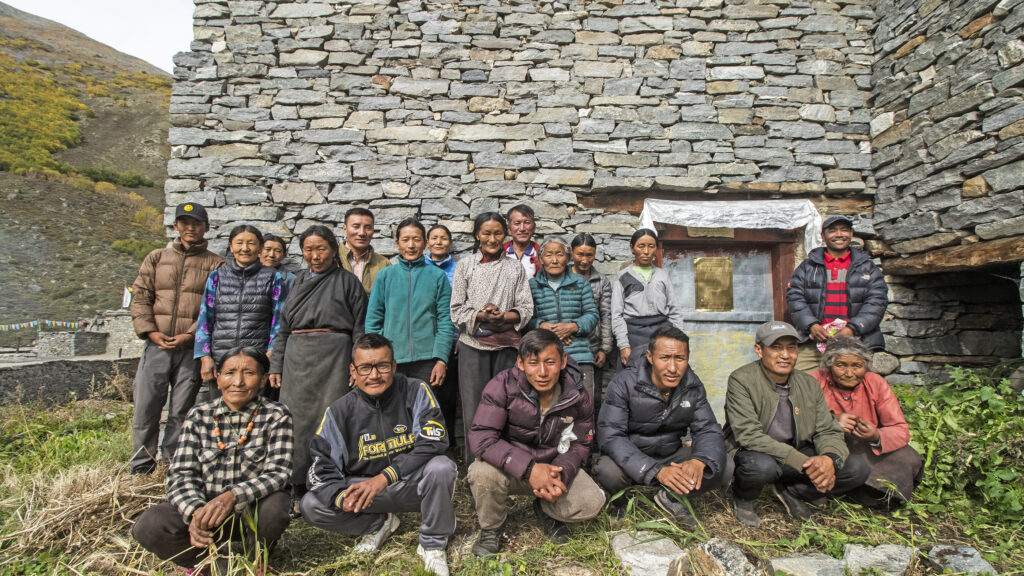 Villagers from Til outside the newly inaugurated communal predator-proof livestock corral (an abandoned corral was purchased for communal use in this village).